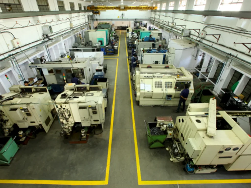 CNC turning section with marked material-flow aisles at the KTA plant